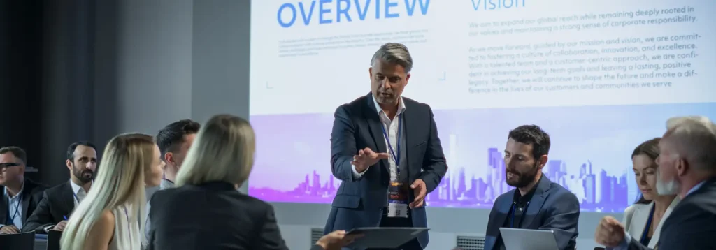 Image of a man speaking at a conference