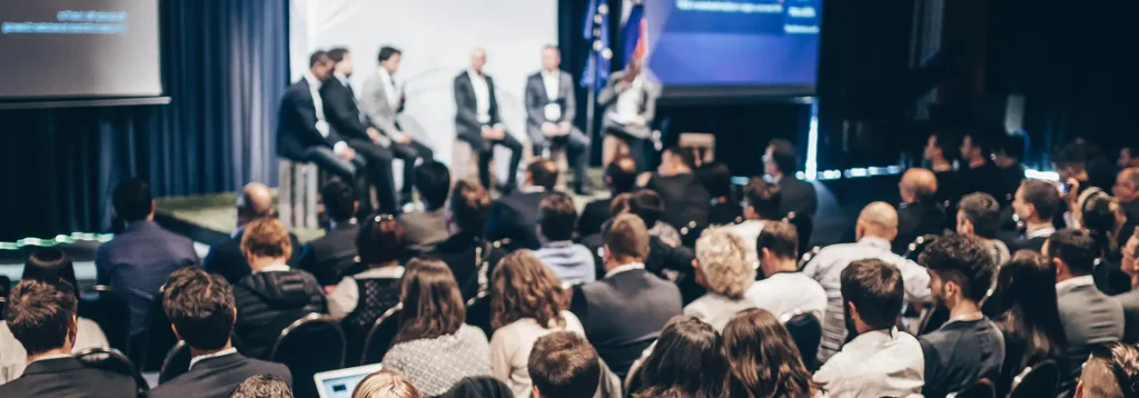 Image of an audience at a conference